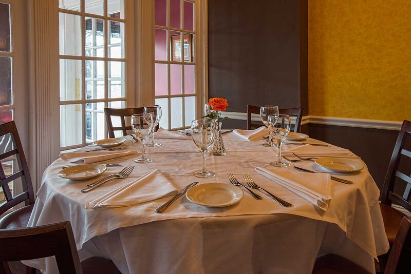 Dining room with set table for six