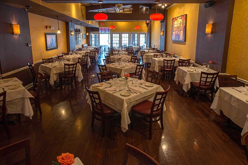 Ariel view of dining room showing many set tables