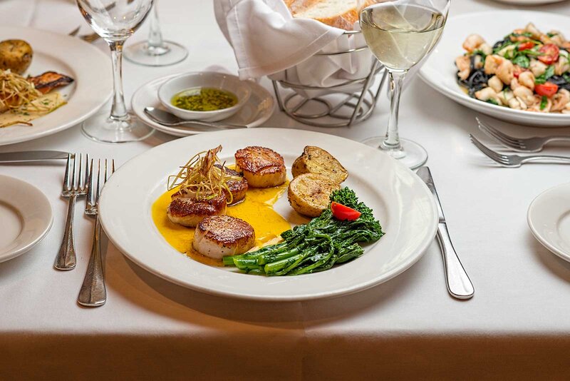 Scallops with side of potato and asparagus